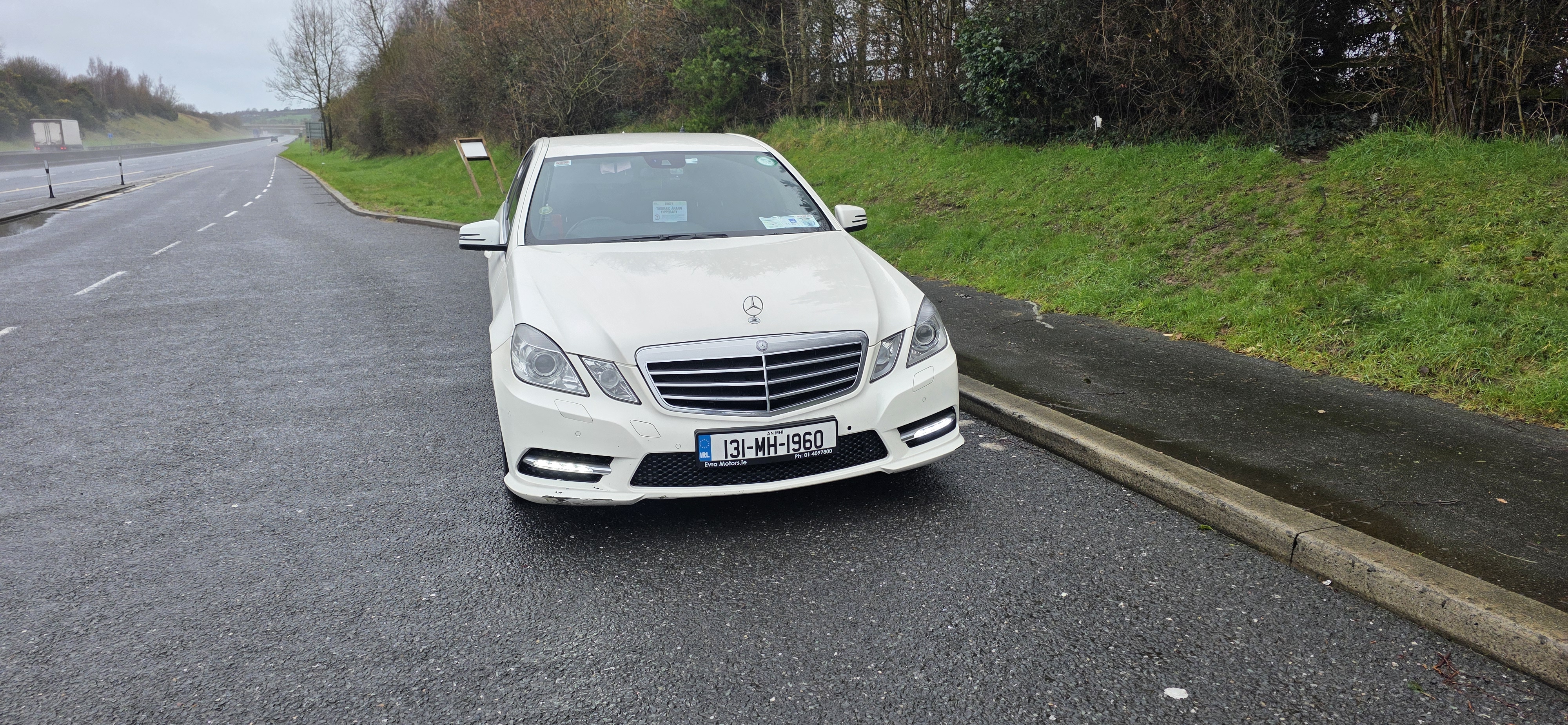 image of a taxi parked at the side of the motorway on an airport run
